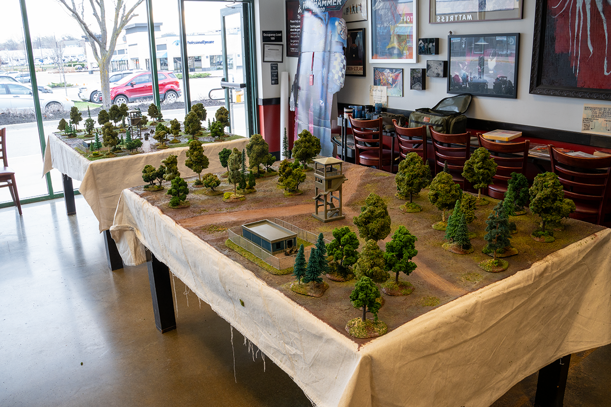 Two identical game tables set up side by side for the Double Blind format